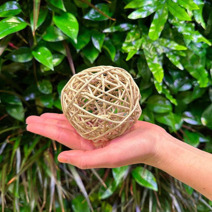 4" vine ball on hand for scale
